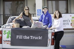 Volunteers posing with the full truck